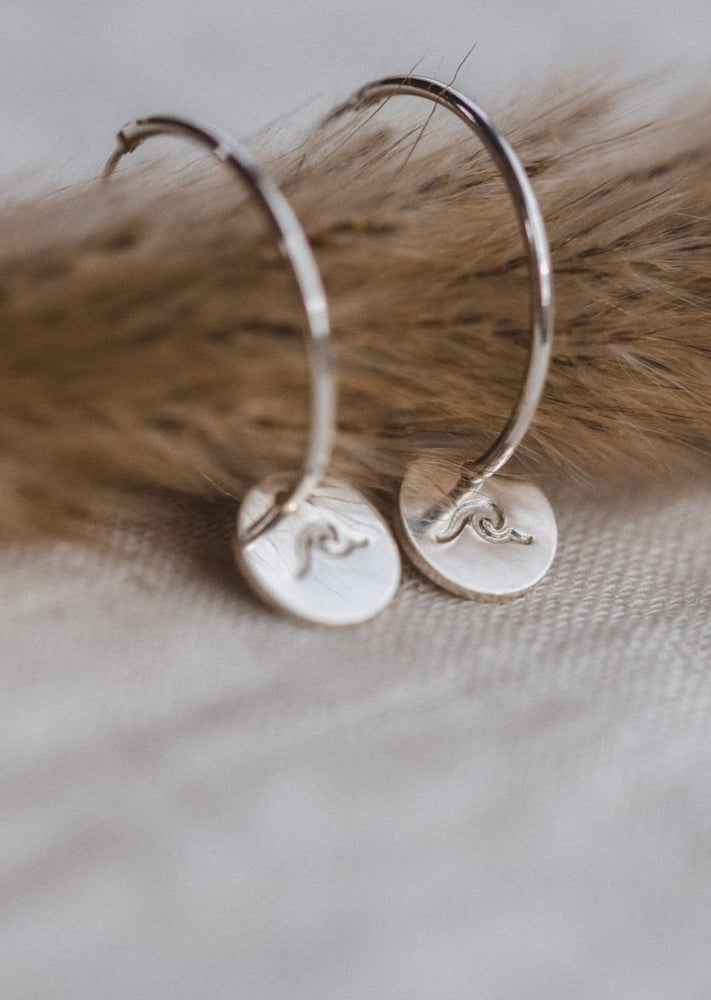 Silver Wave Charm Hoops by Catch The Sunrise